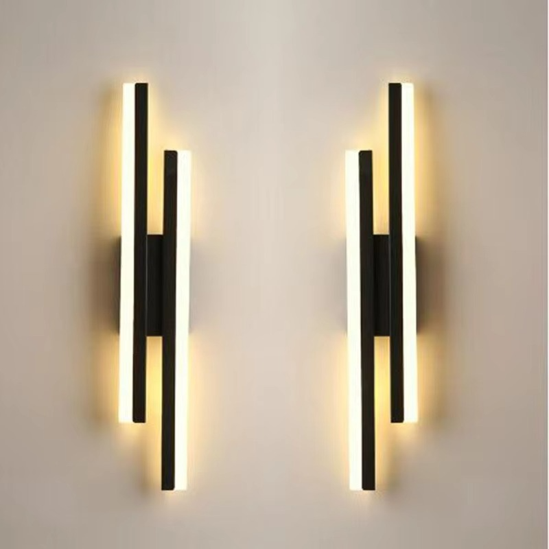 Pair of black Lumina Linear LED wall sconces in left and right orientations