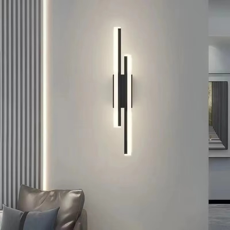 Black Lumina Linear LED wall sconce on a neutral wall above a sofa