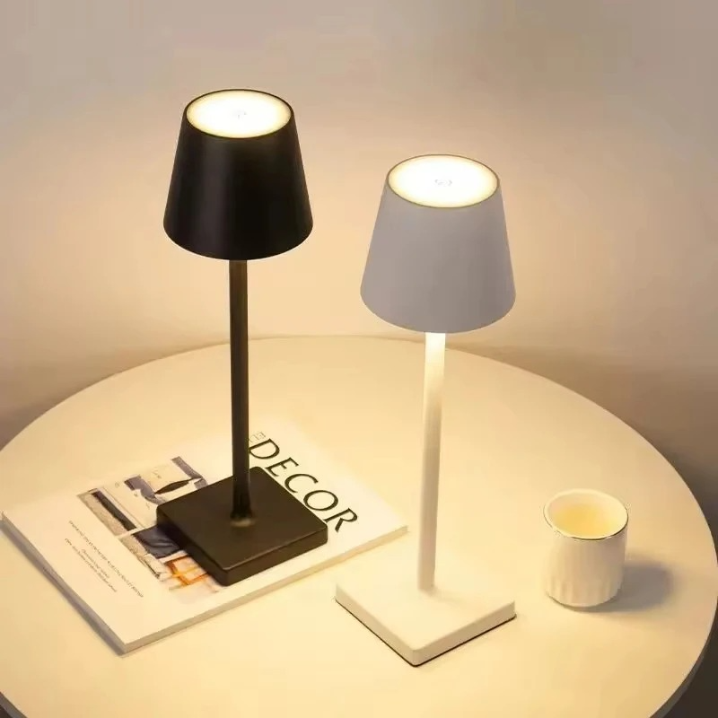 Lumina cordless LED table lamp in black and white on a side table